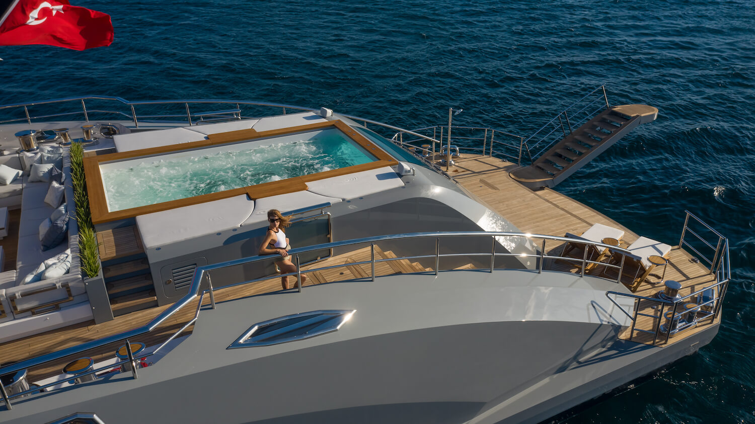 tatiana yacht charter lady posing on the aft deck