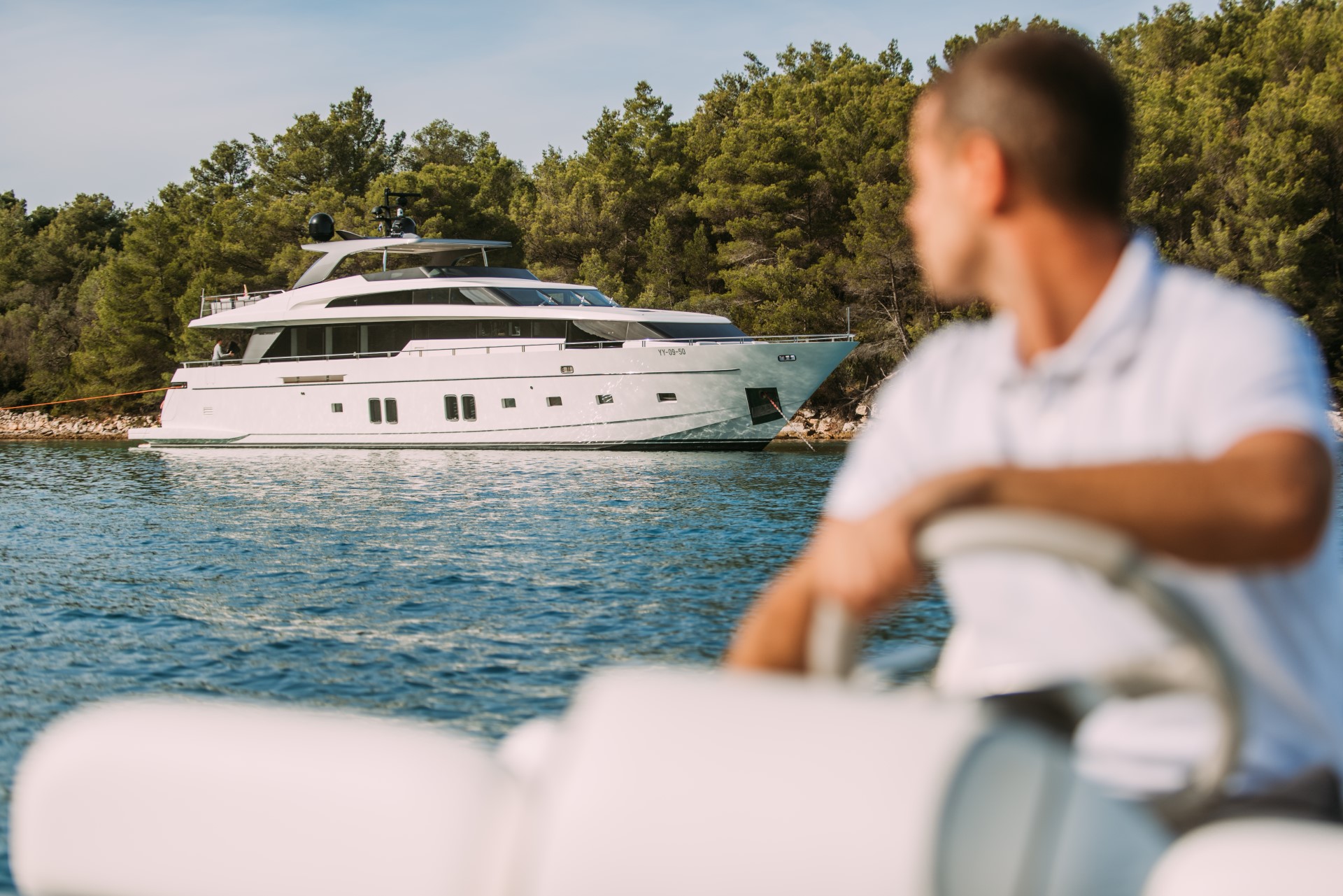 andiamo yacht charter crew member watching yacht