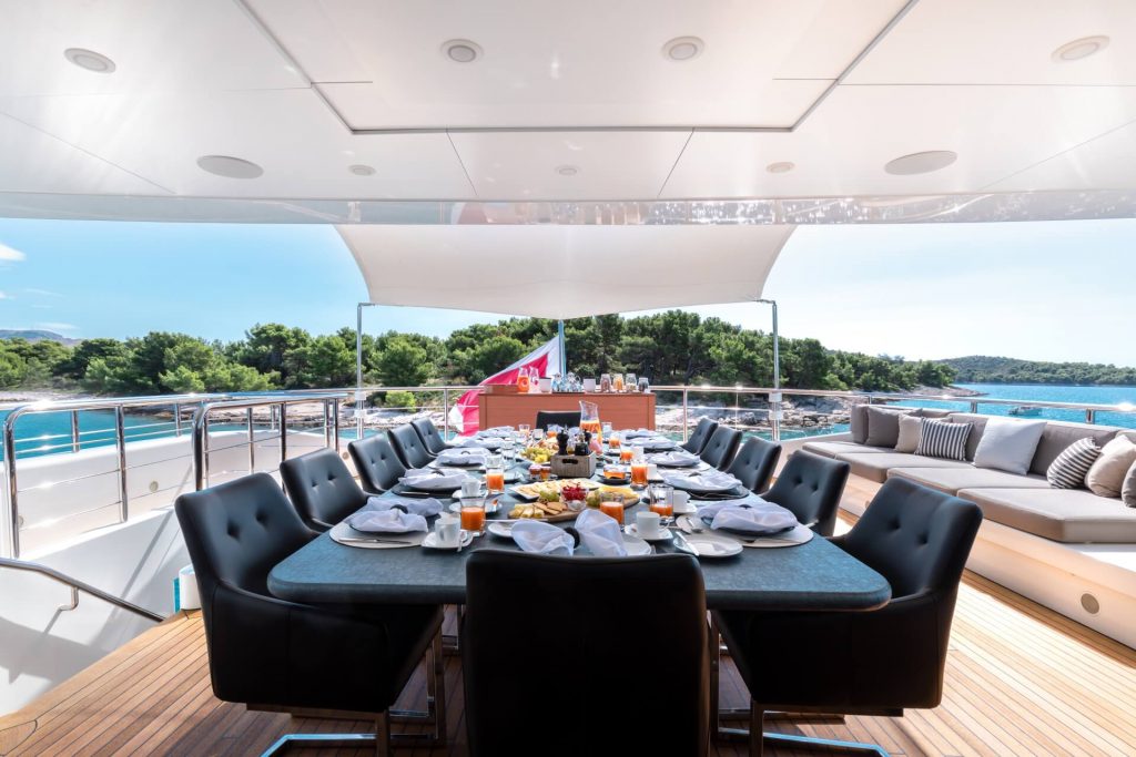 africa I yacht charter dining table on a main deck