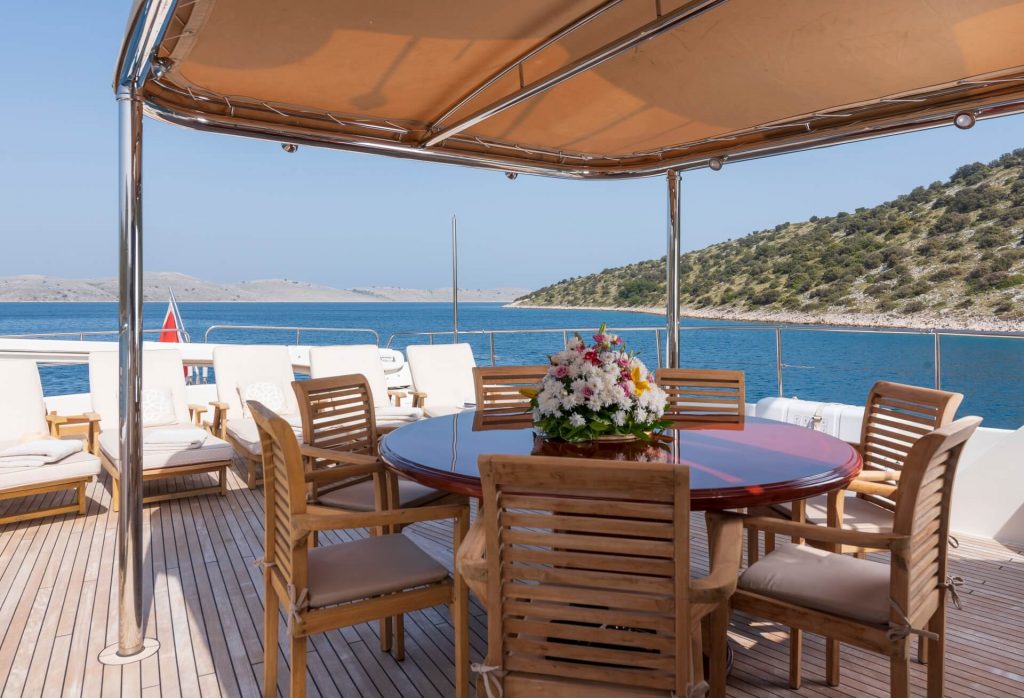 sundeck dining table on the yacht imagine