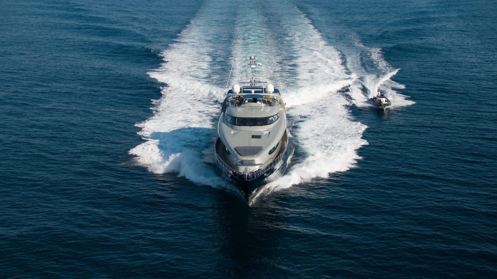 one blue yacht charter at full speed