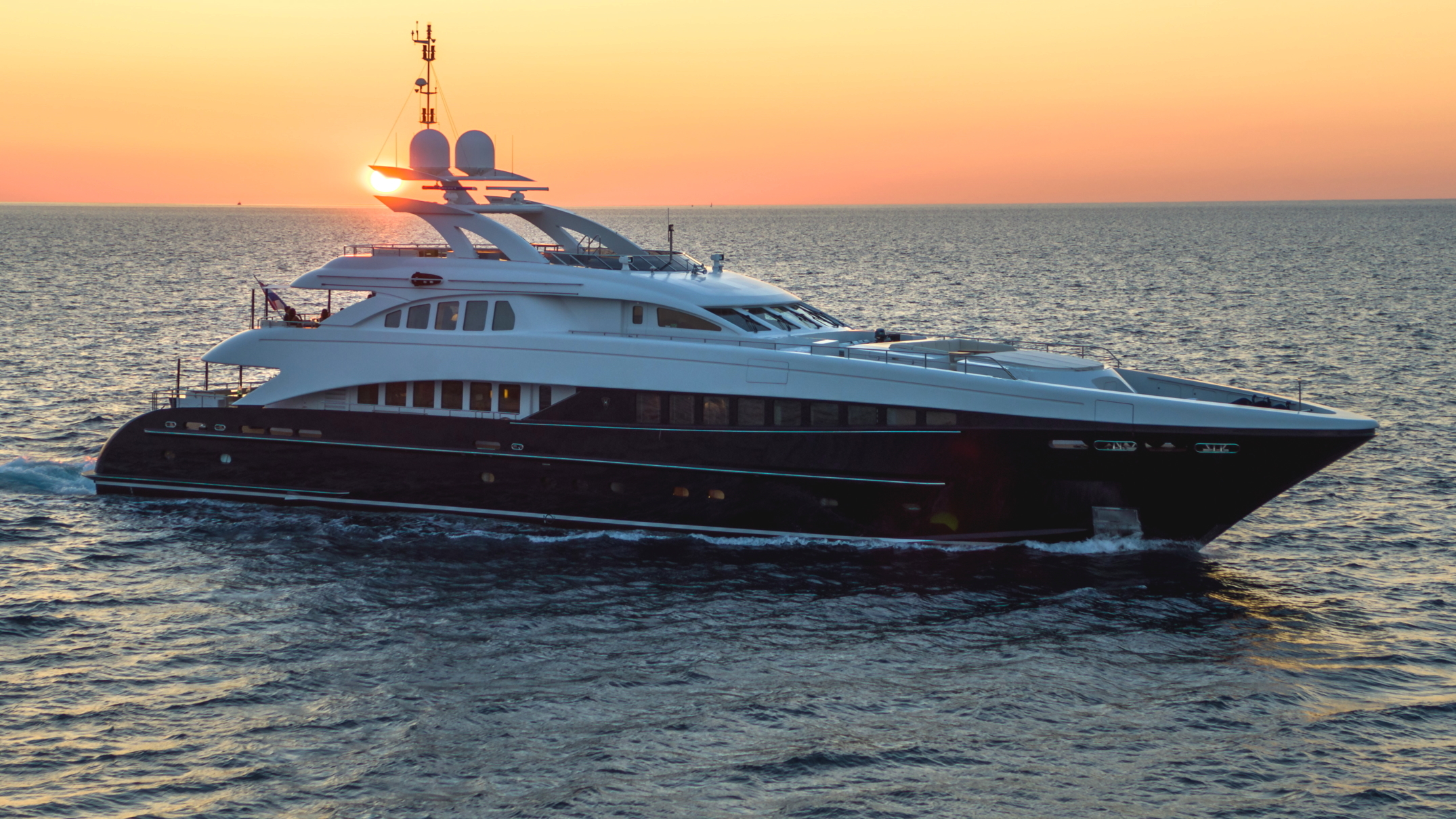 agram yacht charter side view at sunset