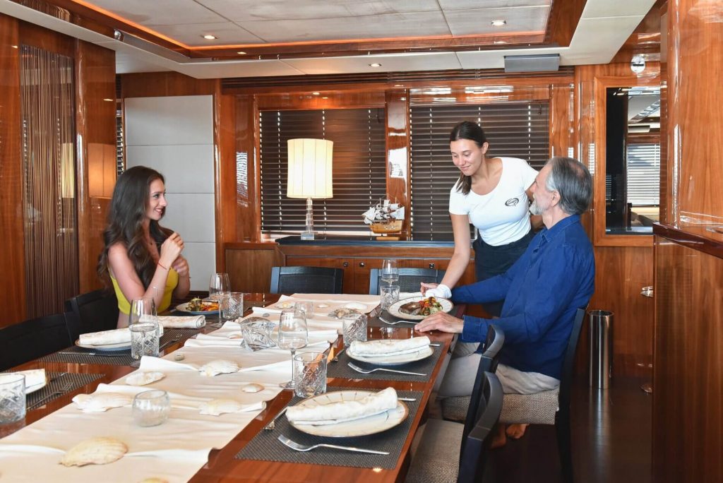 cassiopeia yacht charter crew serving guests
