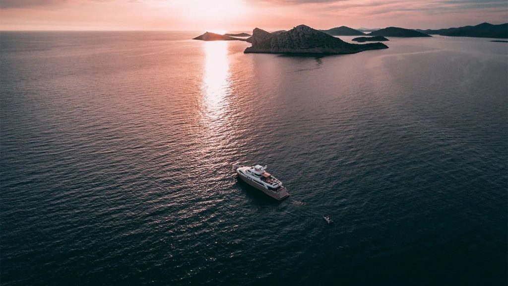 imagine yacht charter at sunset