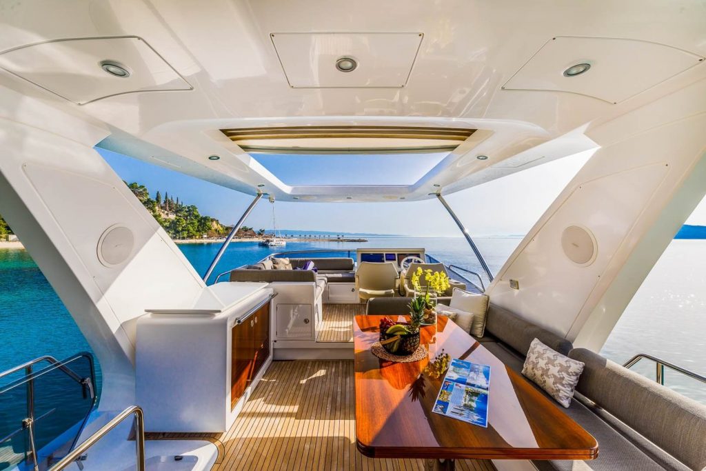 karat II yacht charter flybridge relaxing area with a table