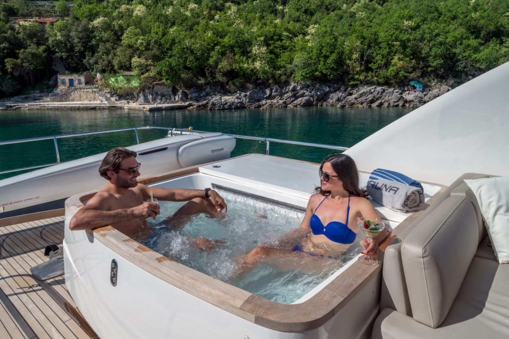couple is relaxing in a yacht jacuzzi