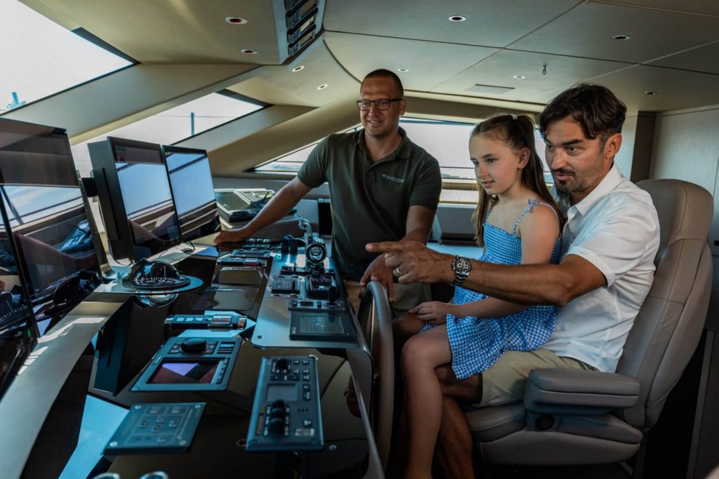 noor II yacht charter captain showing navigation to the guests