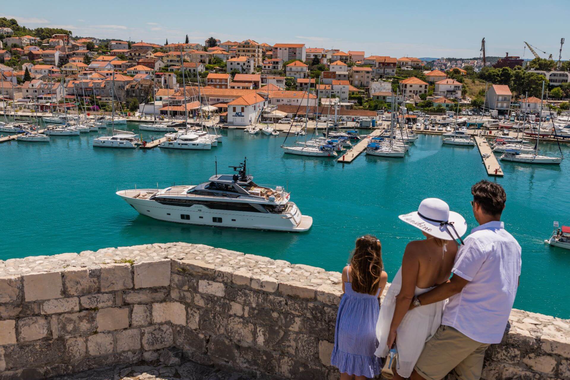 family in trogir by the old city wall
