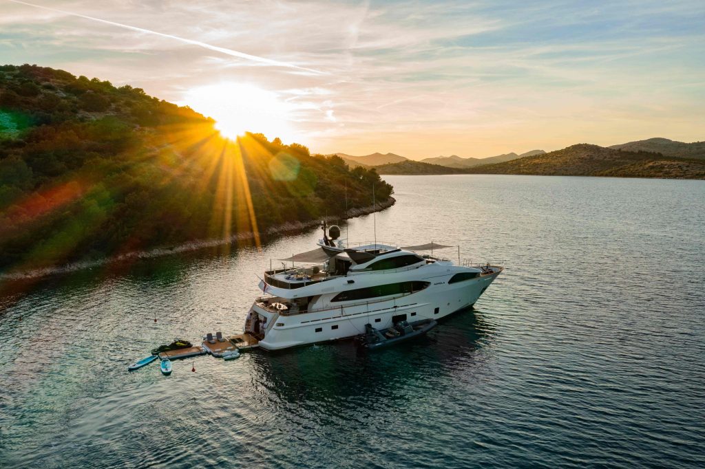 Novela yacht charter at sunset