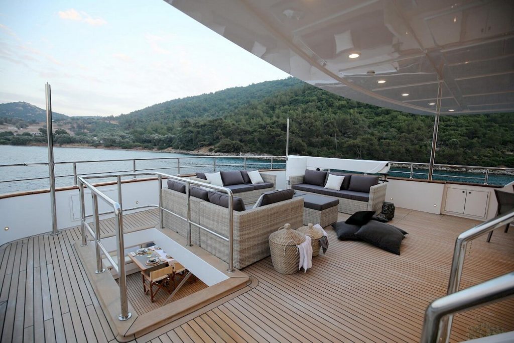 ottawa IV yacht charter main deck with sofas and a coffee table