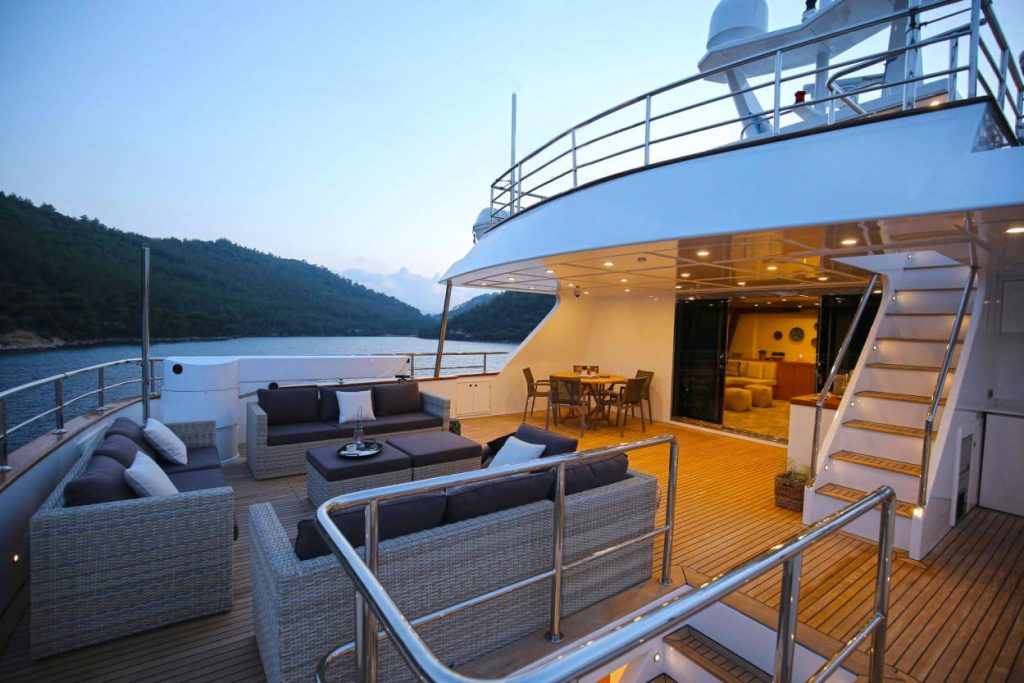ottawa IV yacht charter relaxing deck area with sofas and a coffee table