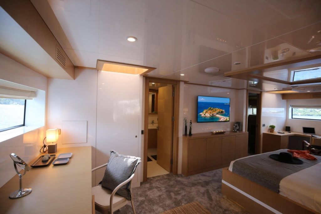 ottawa IV yacht charter master bedroom with a tv on a wall