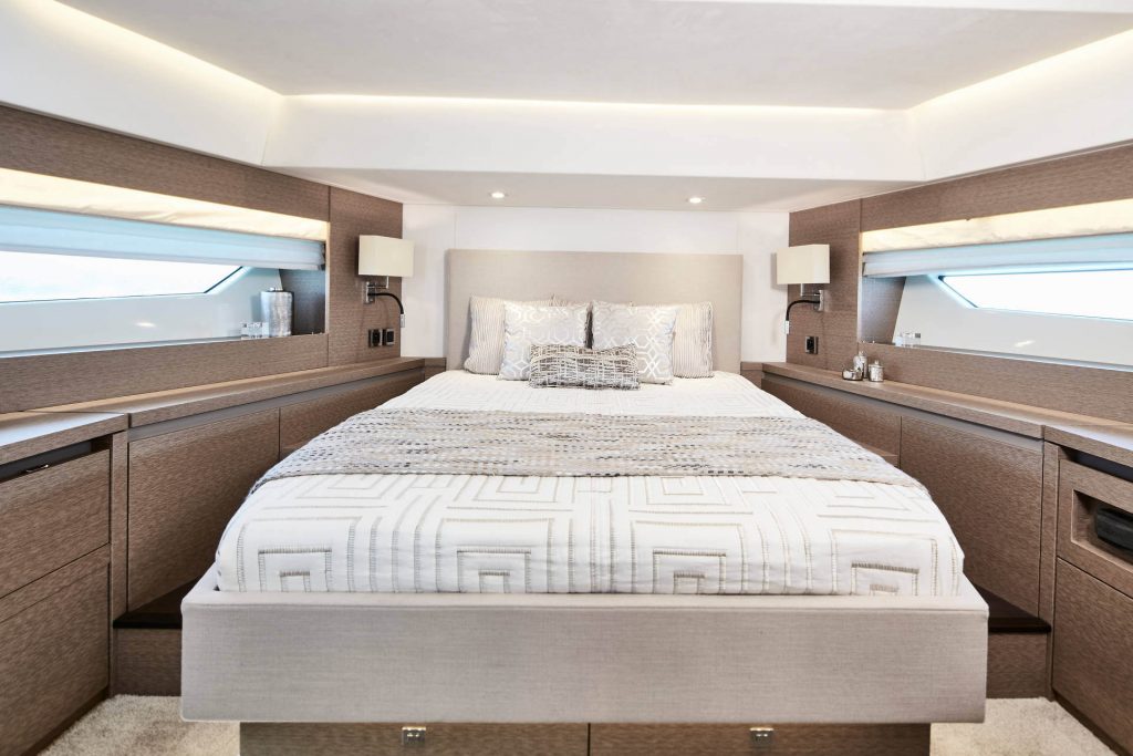 prestige 630 yacht charter master bedroom with large bed in the middle