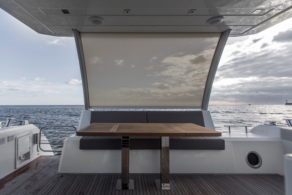 prestige 630 yacht charter aft deck table