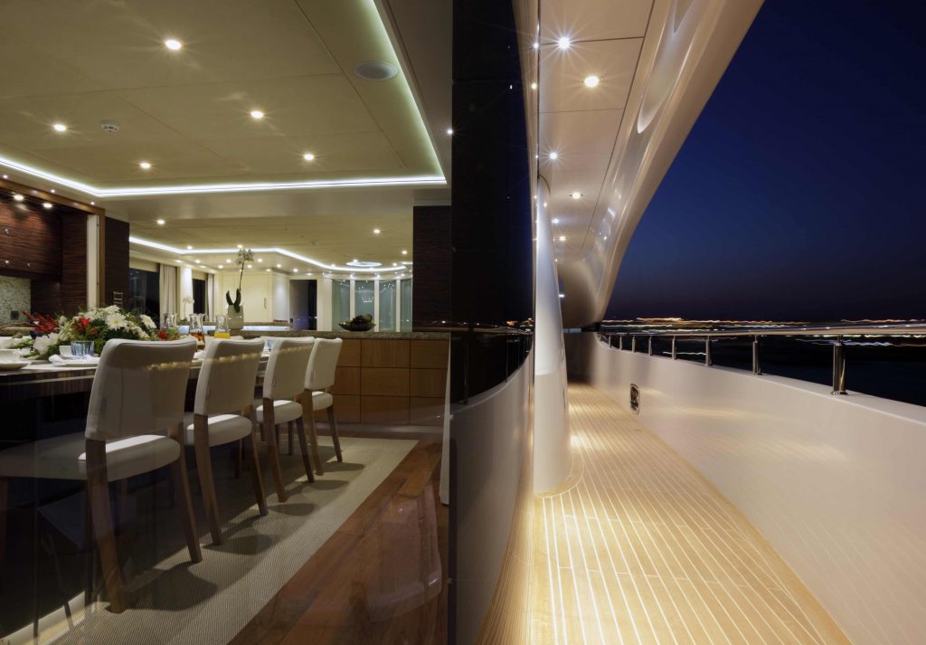 quaranta catamaran yacht charter side deck during night