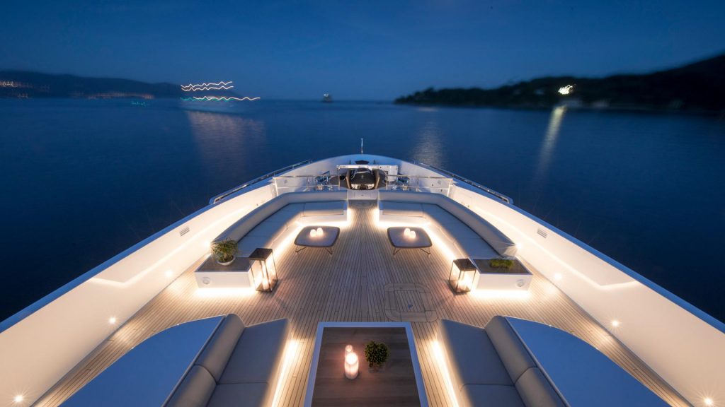 seven sins yacht charter foredeck at night