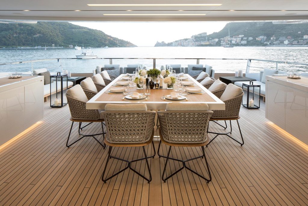 seven sins yacht charter upper deck al fresco dining table