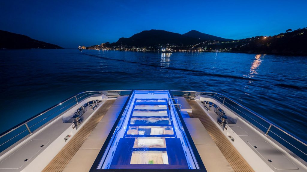 seven sins yacht charter swimming pool at night