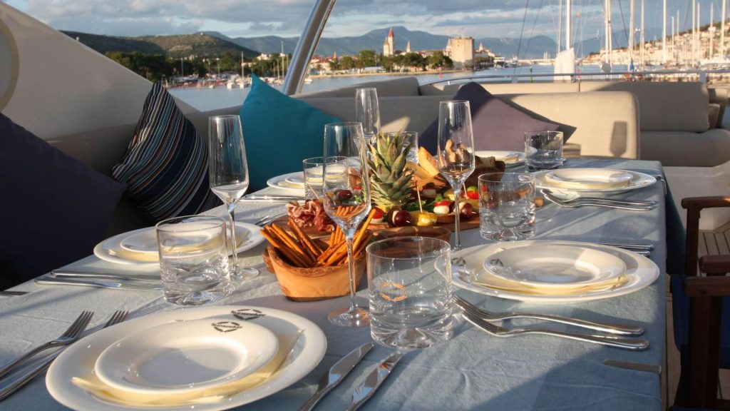 served table with plates on a yacht