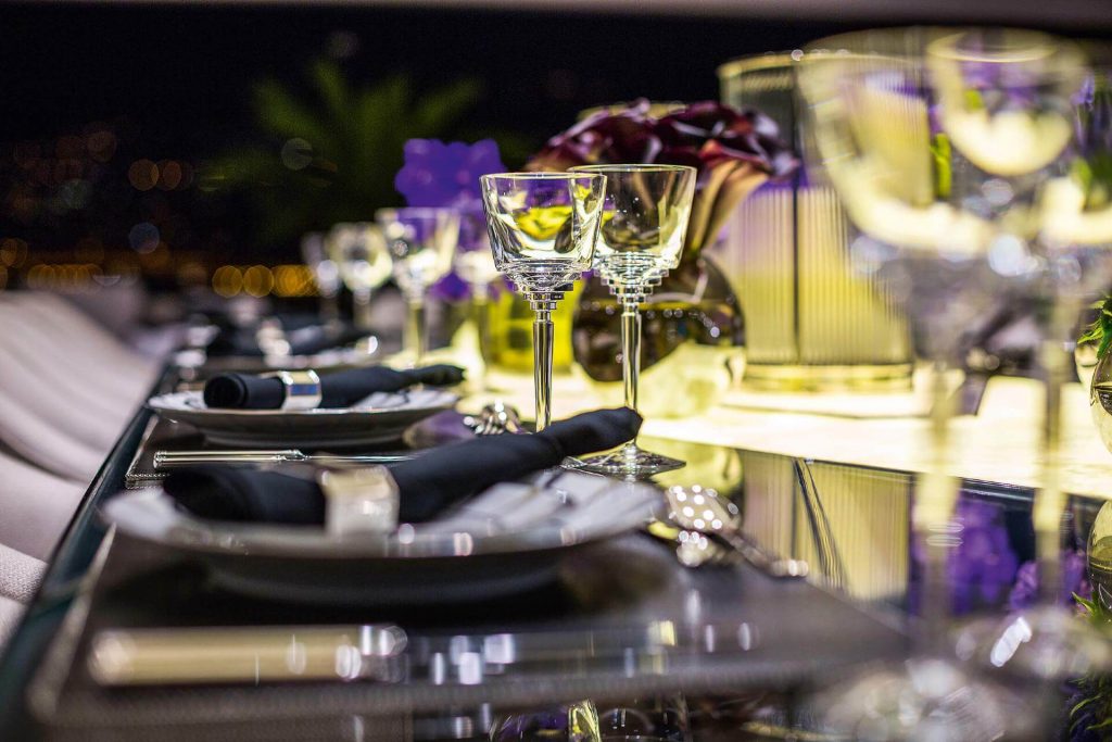 table set with plates and glasses on a superyacht