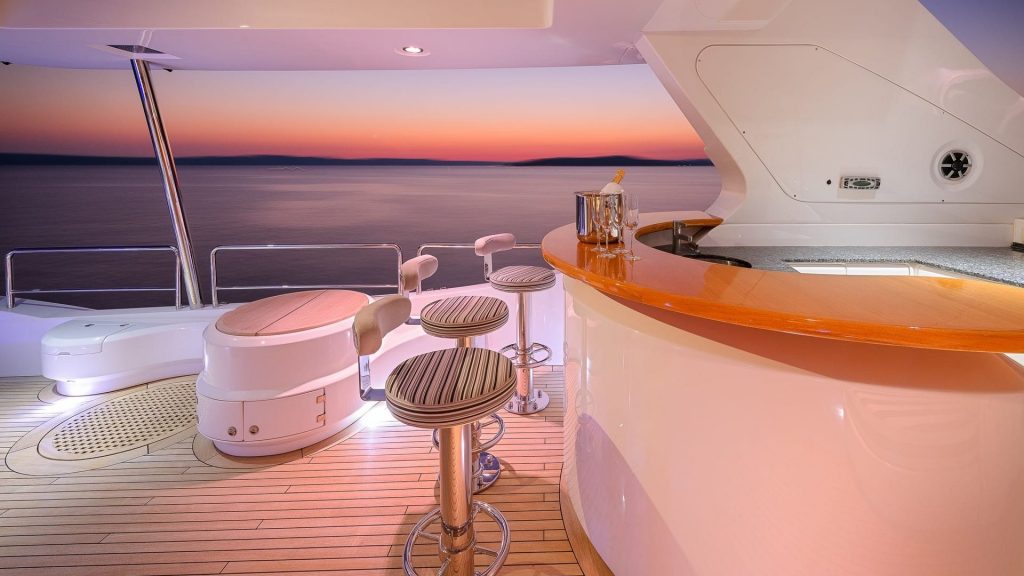 artemy yacht charter private bar at sunset