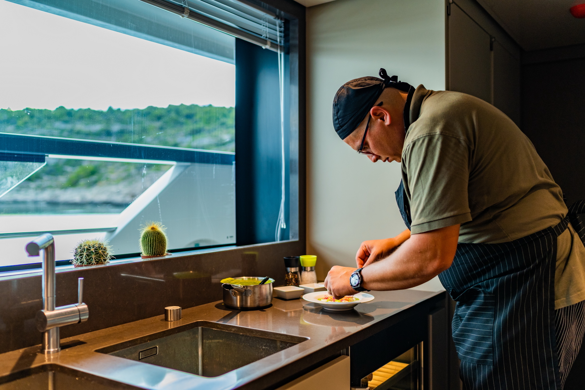 dine on a yacht chef preparing meals
