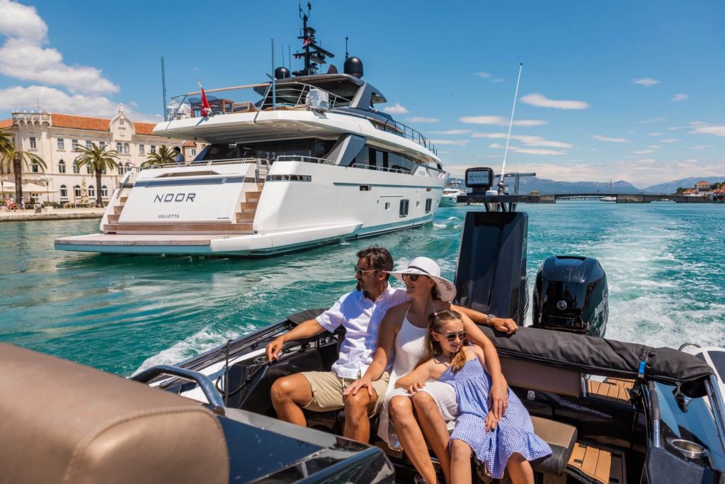 family yacht charter with a family on a small boar by a noor superyacht