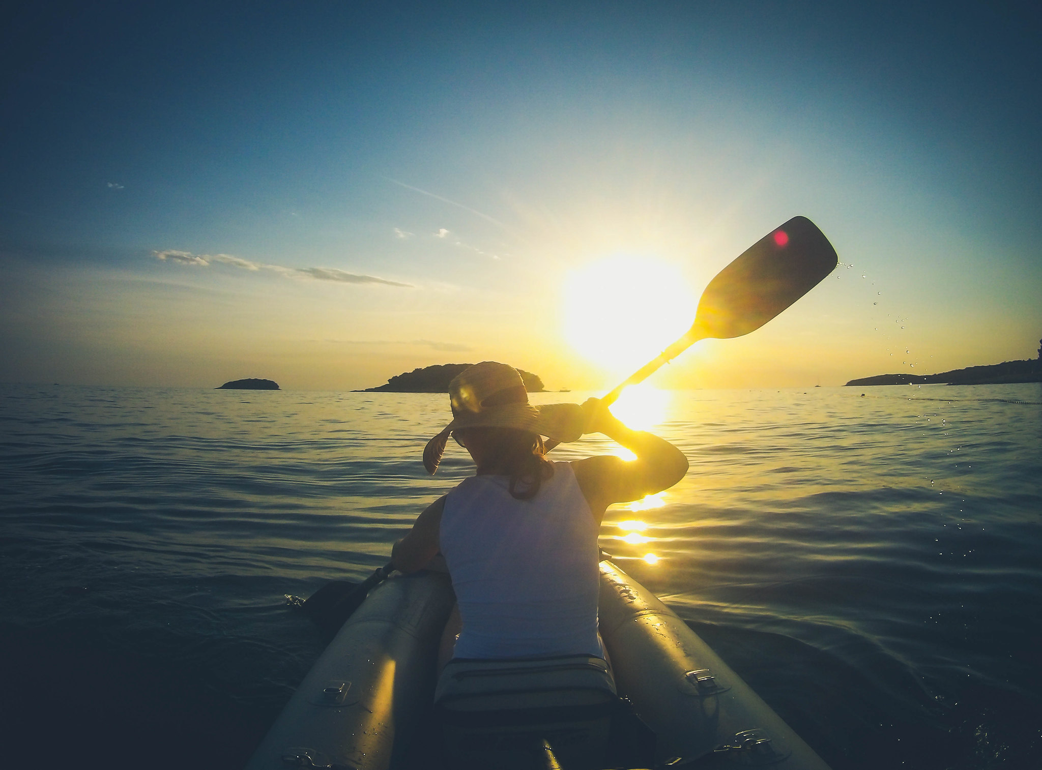 kayaking in croatia during the sunset
