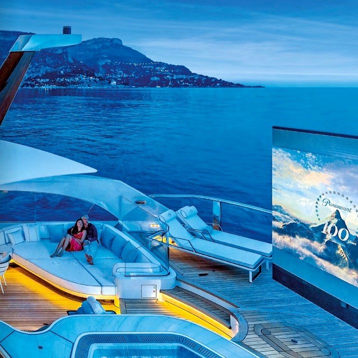 yacht cinema couple relaxing with a movie