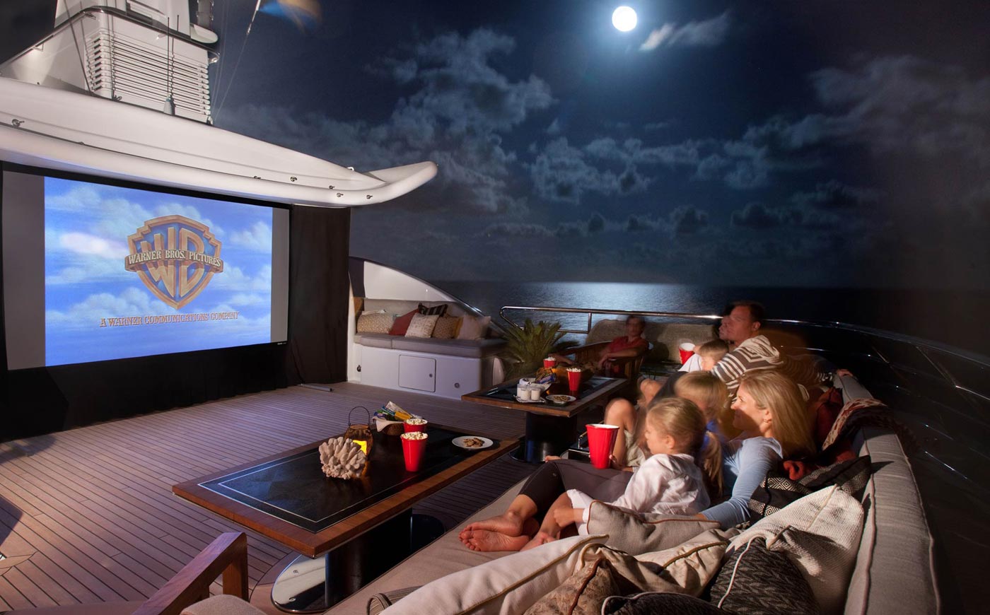 yacht cinema watching movie with kids