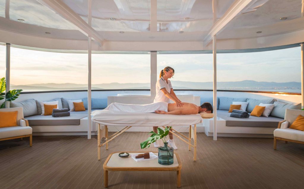 An alfresco massage on an aft deck of a yacht