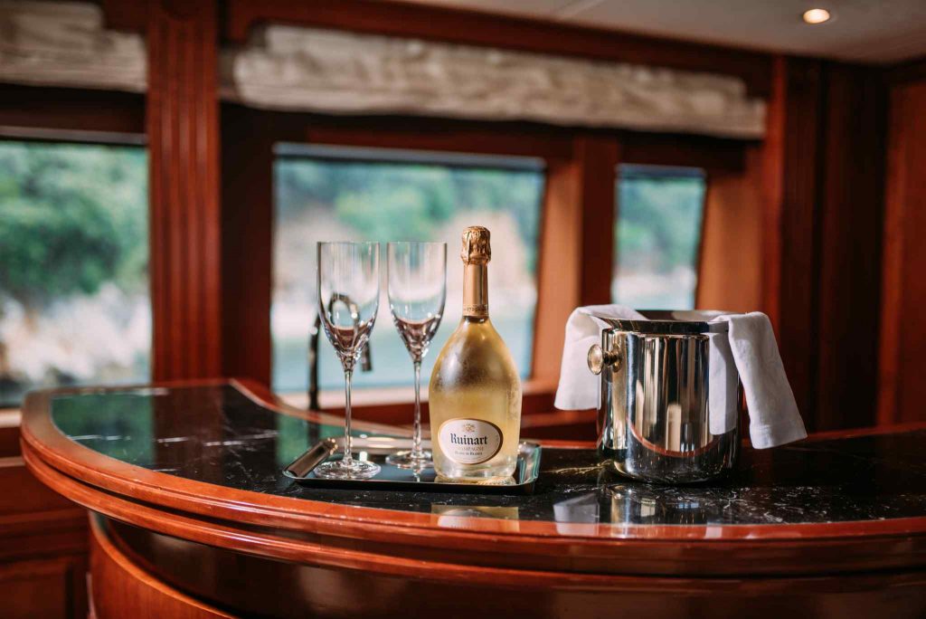 Tirea yacht charter champagne on the bar