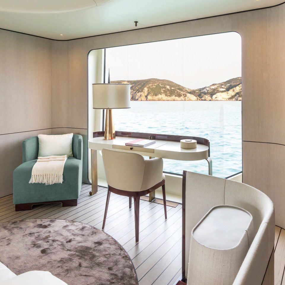 doing business on a yacht sofas and desk by the window