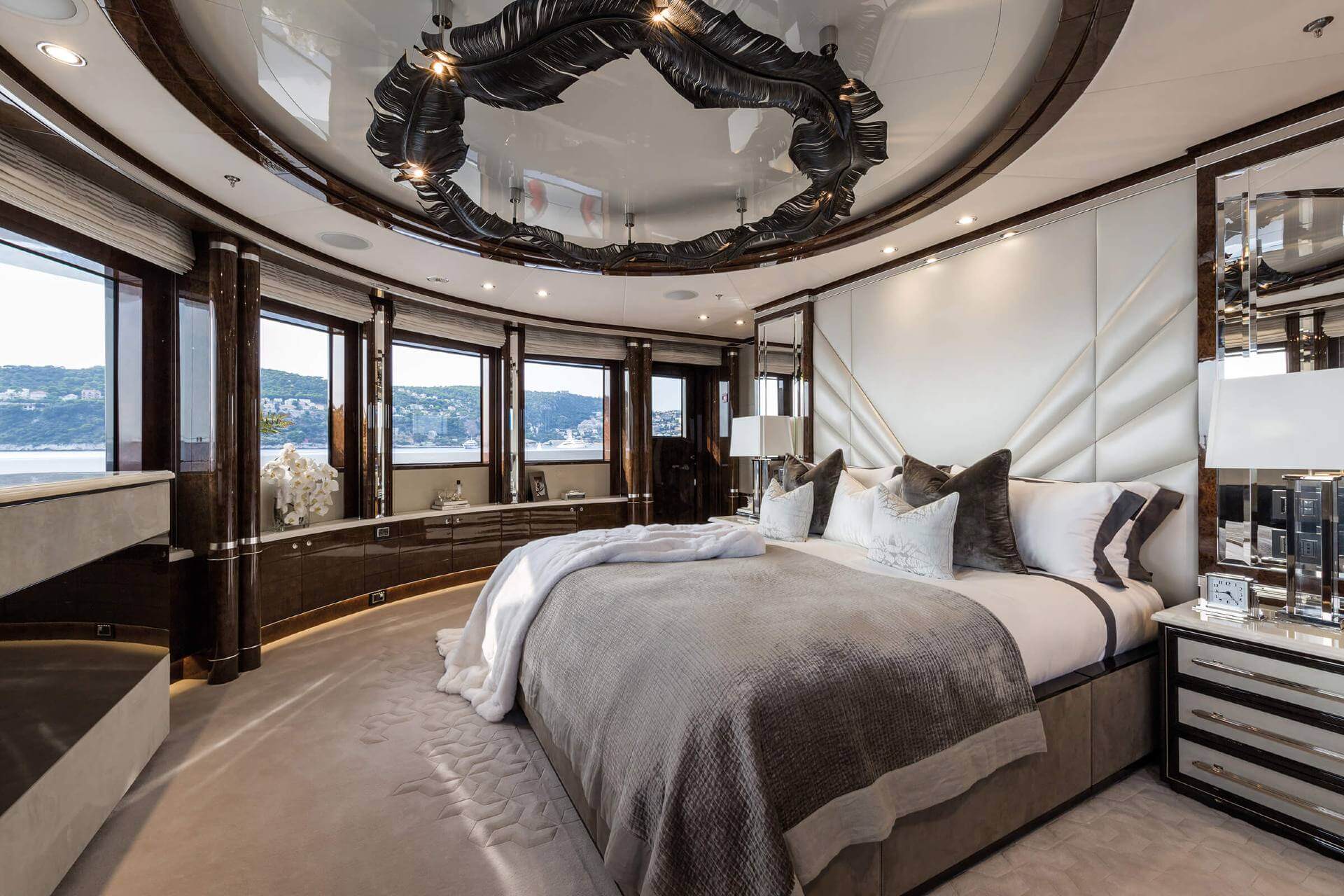 changing bed linens on a yacht luxurious master bedroom