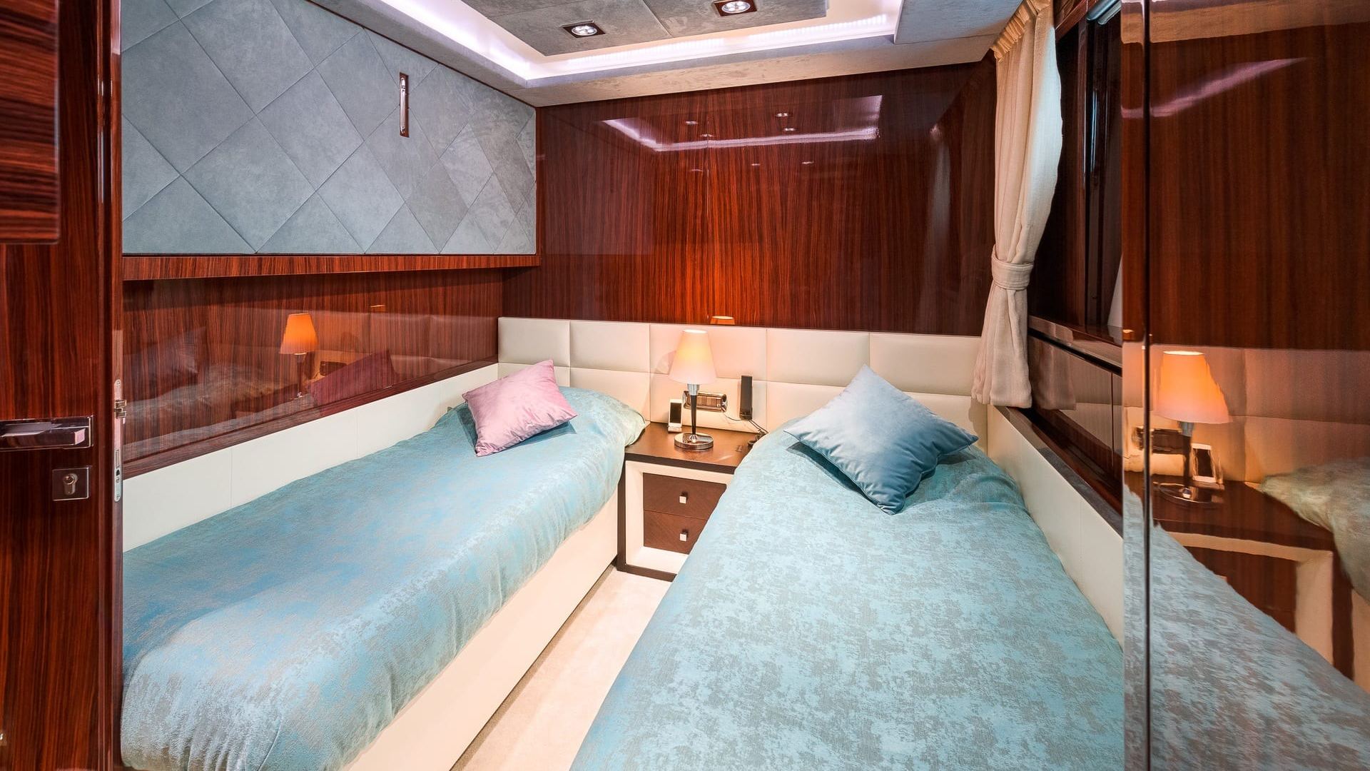 two single beds in a yacht cabin
