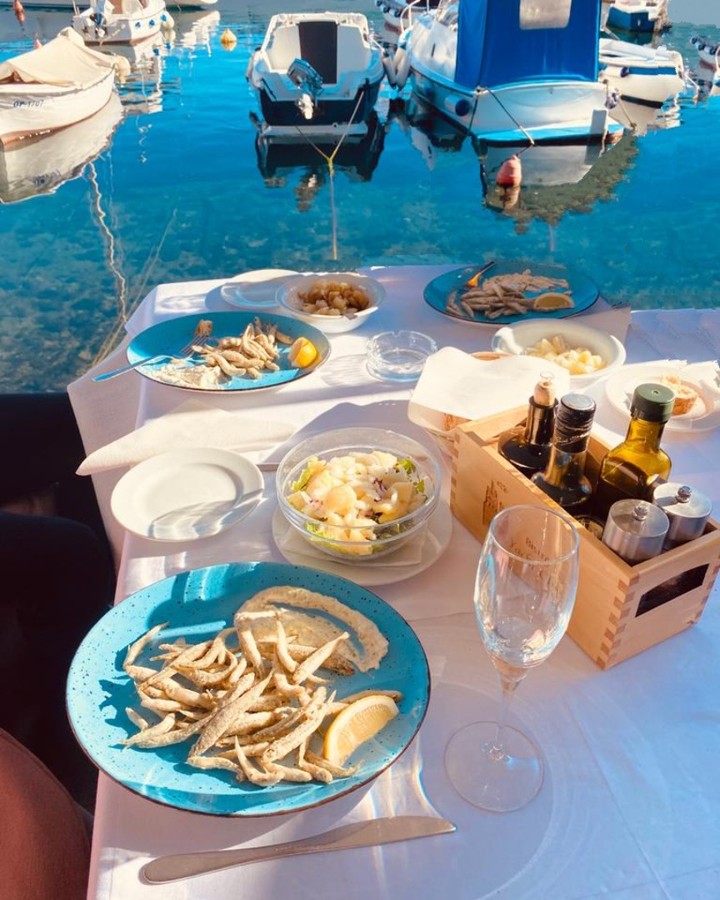 Yacht charter in Opatija food served on the table by the sea