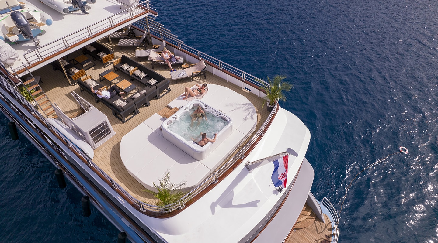 sundeck aft with jacuzzi lounge, seating areas & sun loungers - In deck jacuzzi on a yacht charter in Croatia