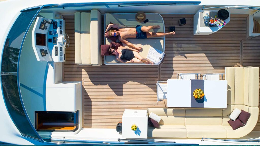 guests sunbathing on a yacht sundeck