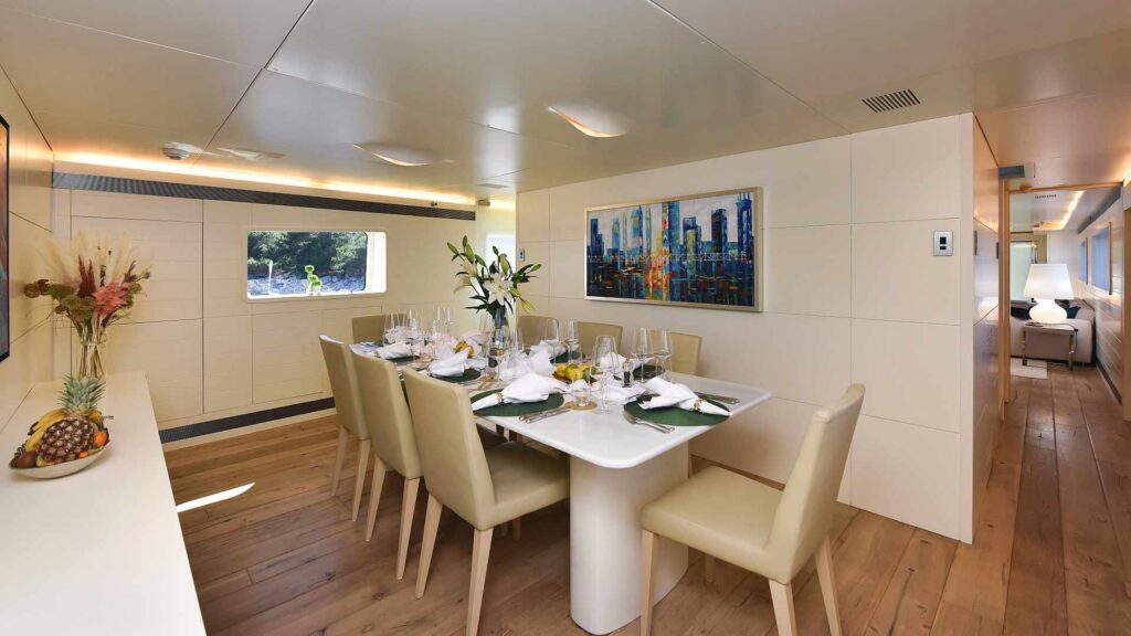 anavi yacht indoor dining area for 8 guests