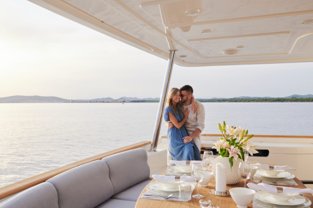 friends boat yacht charter couple on main deck aft