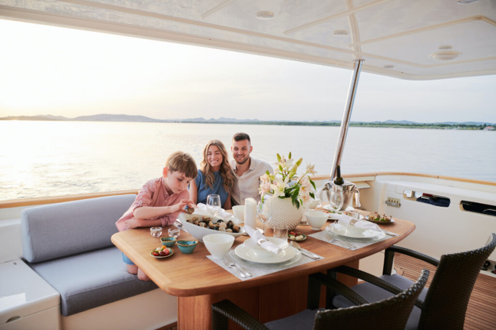 friends boat yacht charter family dining