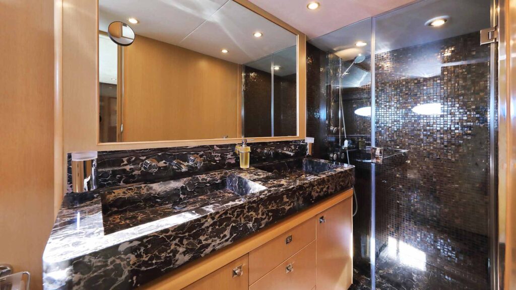 master en suite with black marble and walk in shower