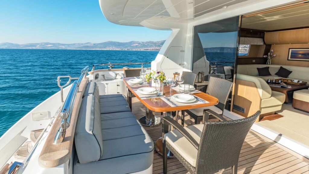 hope i yacht charter aft deck dining table