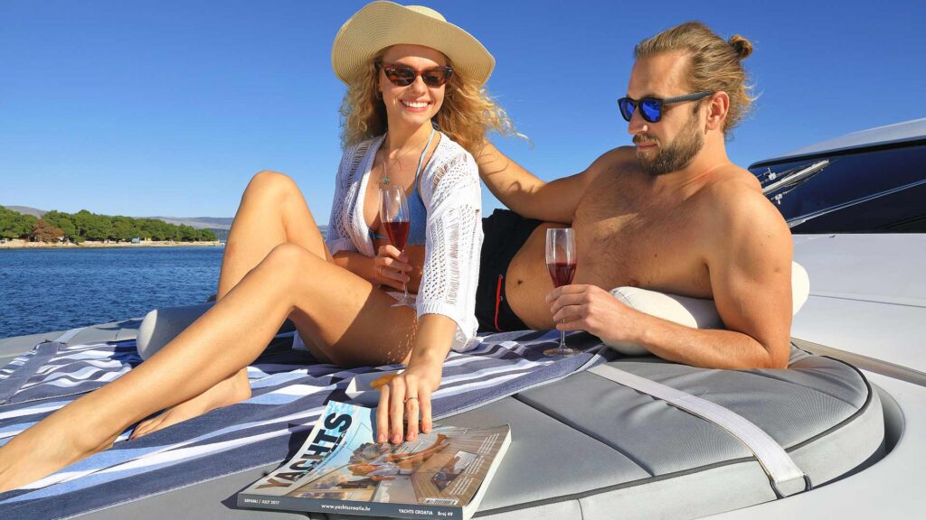 hope i yacht charter couple on sun pads
