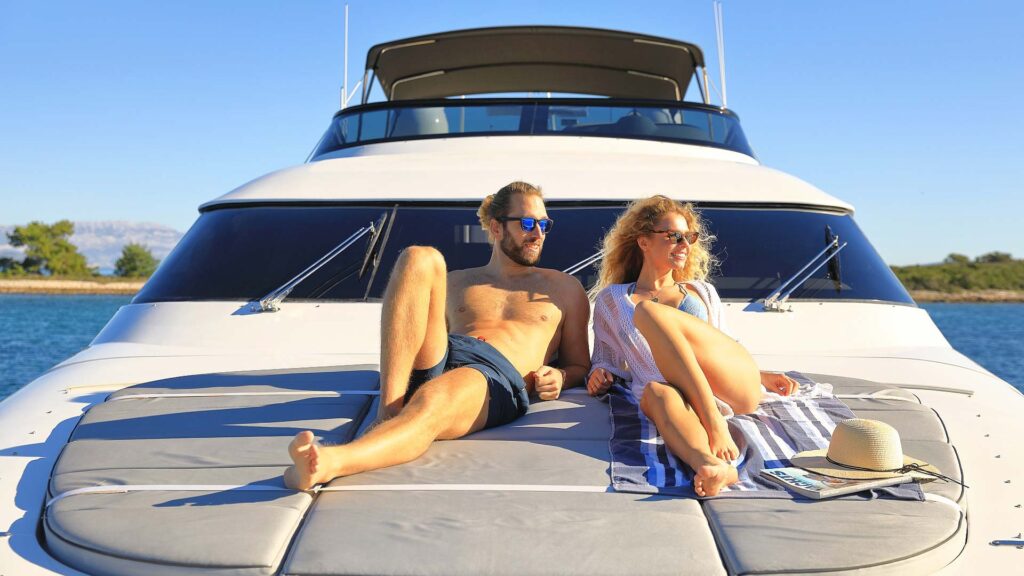 hope i yacht charter couple sunbathing