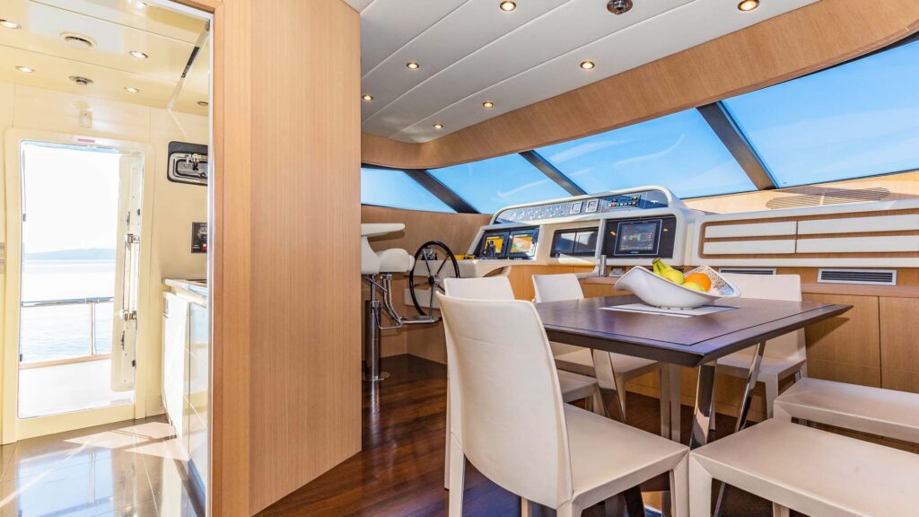hope i yacht charter dining and helm area