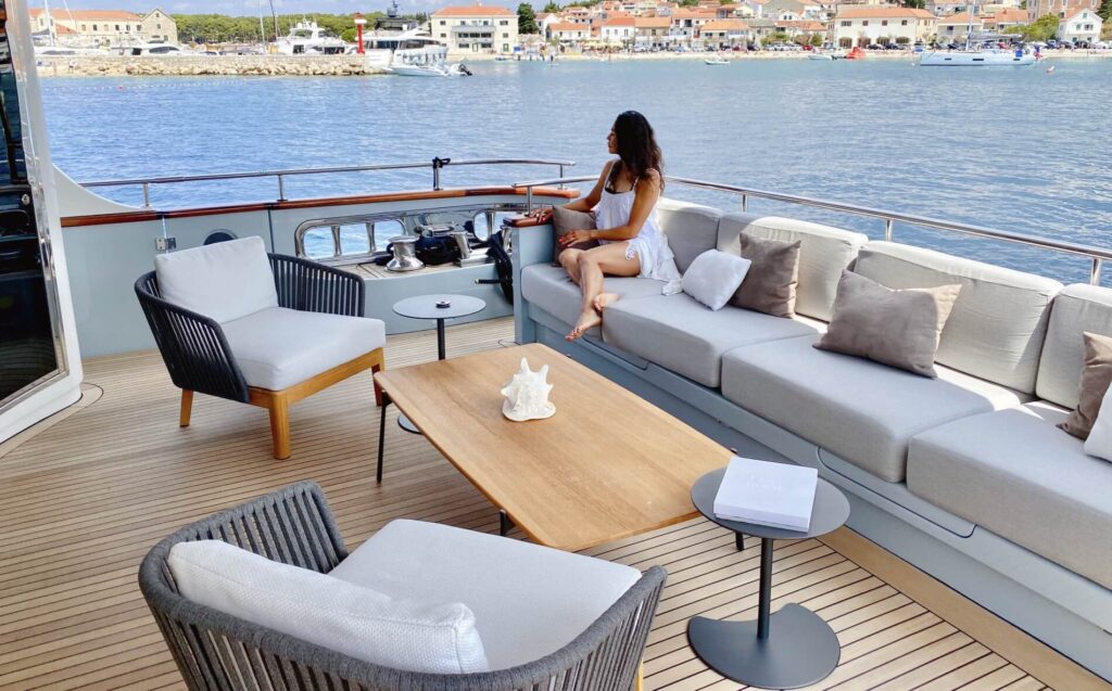 lady on a sofa onboard valentina ii yacht charter