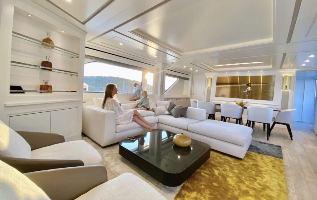 lady with children in a yacht main salon