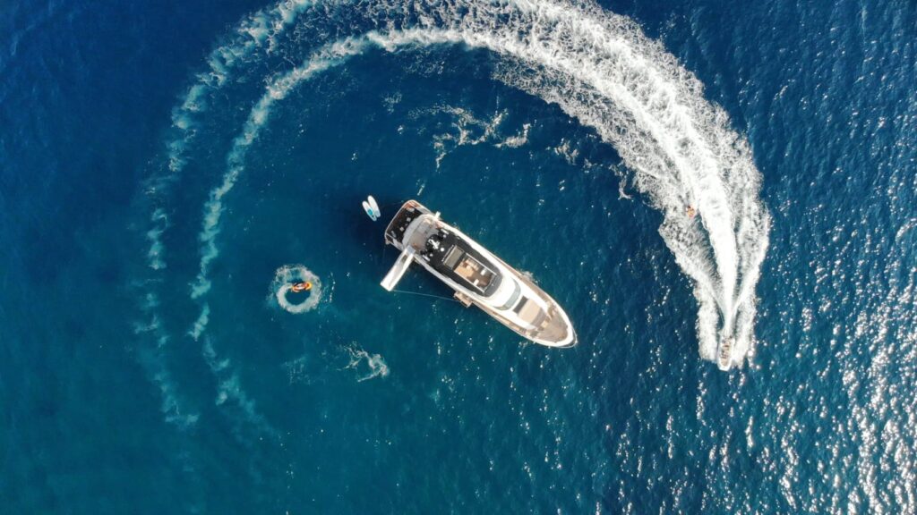 view from above of vivaldi yacht charter with jet ski cruising around