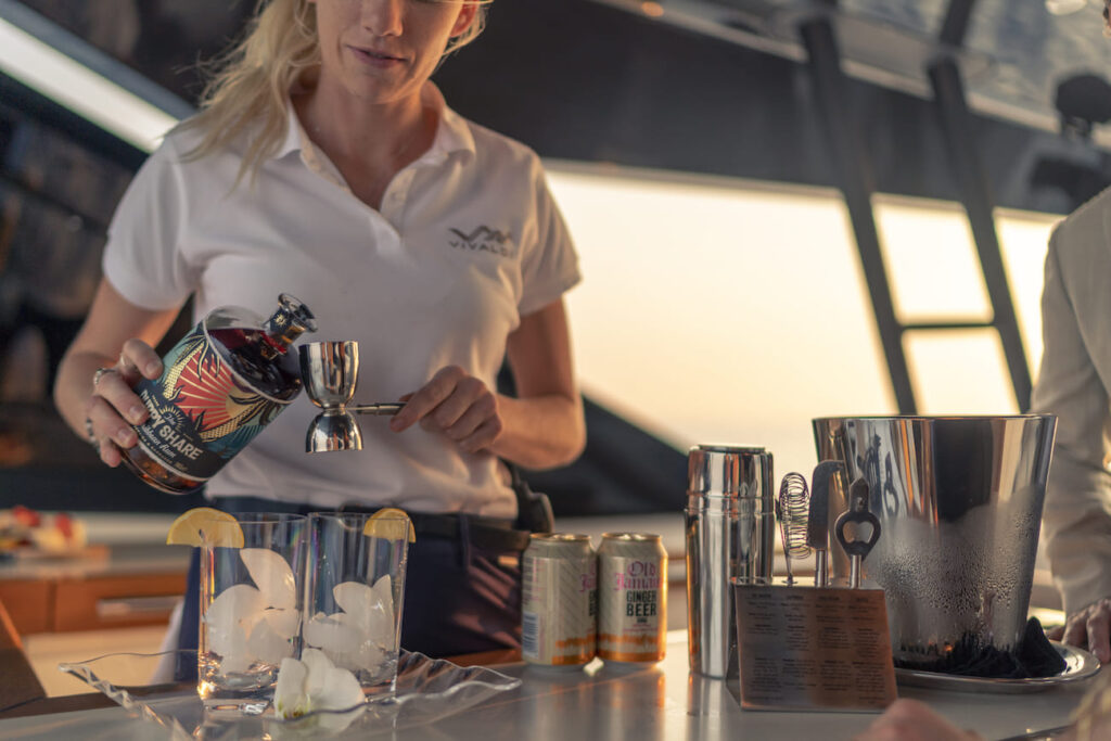 crew member preparing cocktails onboard vivaldi yacht charter